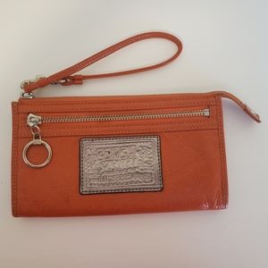 Coach Poppy wristlet in orange